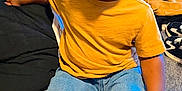 O'Mari is registered to the contest to win money with this photo: toddler, child, smiling, yellow_shirt, jeans, shoes, indoor, blanket, casual, happy, person, footwear, clothing, sitting, home, cozy, cute, young_child, portrait, relaxed