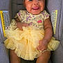 Eli'Yana joined the competition — help win amazing prizes! baby, child, smiling, headband, yellow_dress, car_seat, socks, cute, happy, infant, portrait, clothing, seated, toddler, playful, face, skin, person, baby_girl, adorable