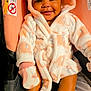 Eli'Yana joined the competition — help win amazing prizes! baby, car_seat, child, cozy, cute, fabric, happy, hooded_robe, indoors, infant, mittens, person, pink, portrait, seat, smiling, socks, soft_texture, warm, white