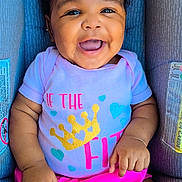 Eli'Yana is registered to the contest to win money with this photo: baby, baby_girl, car_seat, child, closeup, clothing, colorful, cute, drool, happy, headwear, indoors, infant, person, pink_bow, pink_skirt, portrait, seatbelt, shirt, smiling
