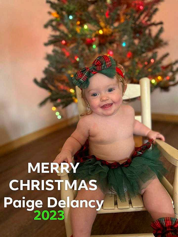 Paige joined the competition — help win amazing prizes! baby, baby_toddler_clothing, christmas, christmas_decoration, christmas_ornament, christmas_tree, event, facial_expression, fun, happy, head, headwear, holiday, holiday_ornament, human_body, joy, leg, ornament, person, plant