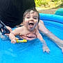 adult, baby, child, fun, garden, greenery, hand, happy, outdoor, person, play, pool, smile, splash, summer, sunlight, tongue, toy, water, wrist_brace