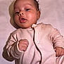 Kaleela joined the competition — help win amazing prizes! baby, infant, pink_onesie, clothing, face, hands, lying_down, curly_hair, skin, expression, portrait, child, newborn, soft_fabric, blanket, cute, indoors, baby_gesture, young_child, human