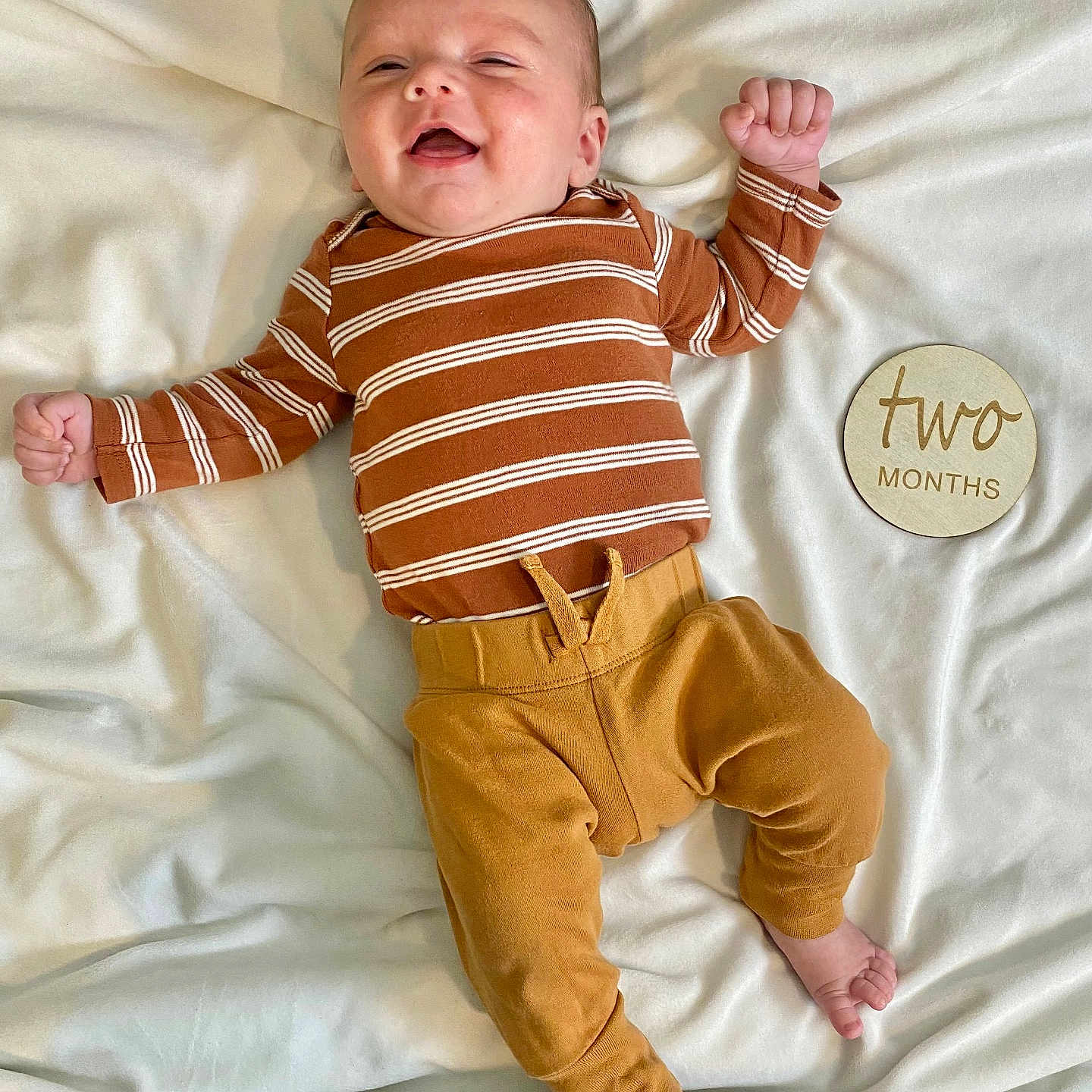 Jameson is registered to the contest to win money with this photo: baby, babylaughing, bed, bedroom, clothing, cushion, face, furniture, happy, head, homedecor, indoors, jeans, laughing, newborn, pants, person, photography, portrait, room