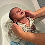 baby, infant, bath, water, hands, cloth, wrapped, tub, skin, head, expression, person, care, support, newborn, wet, bathroom, comfort, closeup, parent