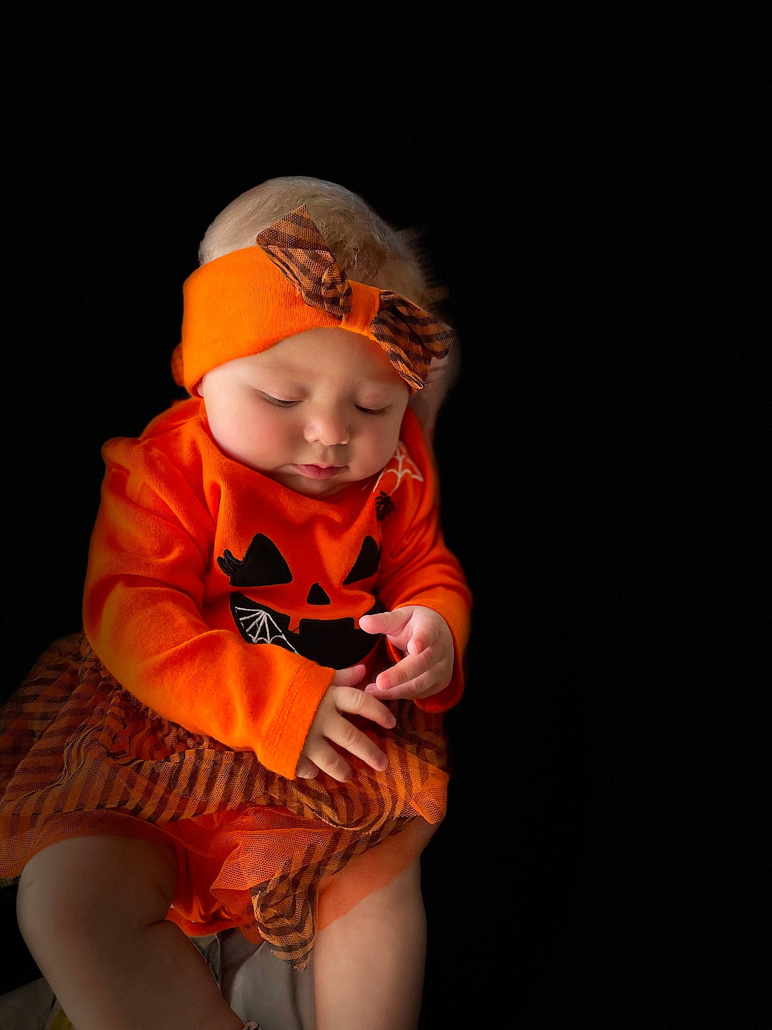 Mackenzie is registered to the contest to win money with this photo: baby, baby_toddler_clothing, cap, child, flash_photography, flesh, fun, happy, hat, headwear, human_leg, orange, peach, person, personal_protective_equipment, portrait, portrait_photography, sitting, sleeve, t_shirt