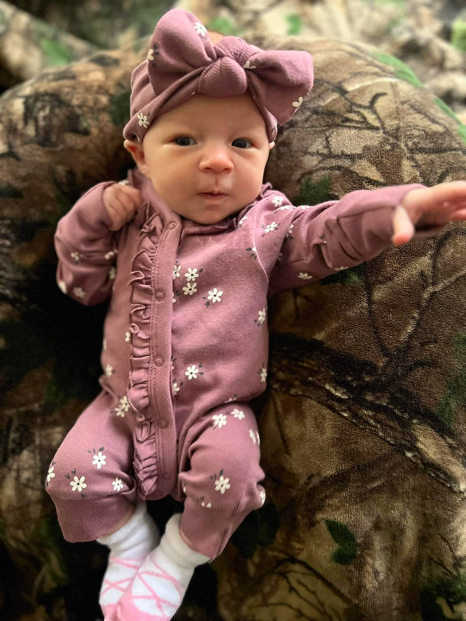 Stella is registered to the contest to win money with this photo: baby, baby_toddler_clothing, beauty, cap, child, eye, fashion_accessory, gesture, grass, happy, head, headwear, magenta, military_camouflage, pattern, people_in_nature, person, photograph, pink, skin