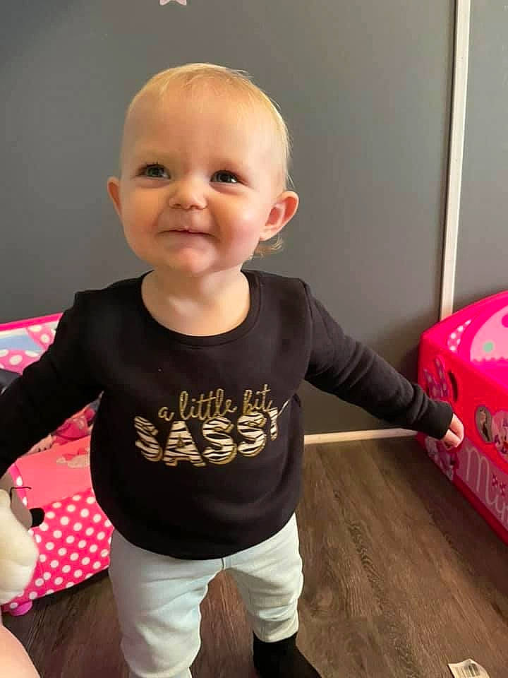 Harlyn joined the competition — help win amazing prizes! baby, baby_toddler_clothing, cheek, child, facial_expression, floor, flooring, fun, happy, joy, knee, pattern, person, skin, sleeve, smile, sock, standing, t_shirt, toddler