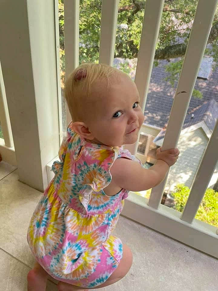 Harlyn is registered to the contest to win money with this photo: baby, baby_toddler_clothing, blond, child, day_dress, dress, hair, hairstyle, head, leisure, mammal, one_piece_garment, person, plant, product, skin, sleeve, standing, thumb, toddler