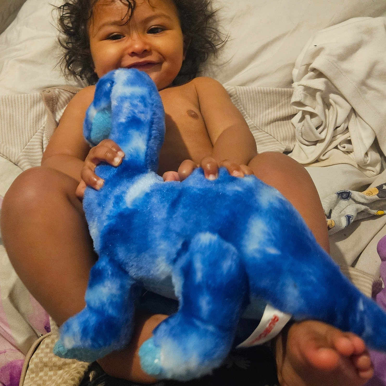 Luca is registered to the contest to win money with this photo: baby, bed, bedroom, bodypart, clothing, couch, cushion, face, footwear, furniture, head, homedecor, indoors, person, photography, plush, portrait, room, shoe, toy