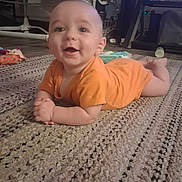 Forrest joined the competition — help win amazing prizes! baby, infant, orange_onesie, rug, floor, indoor, furniture, toy, happy, smiling, child, crawling, person, carpet, home, cute, young, hands, head, flooring