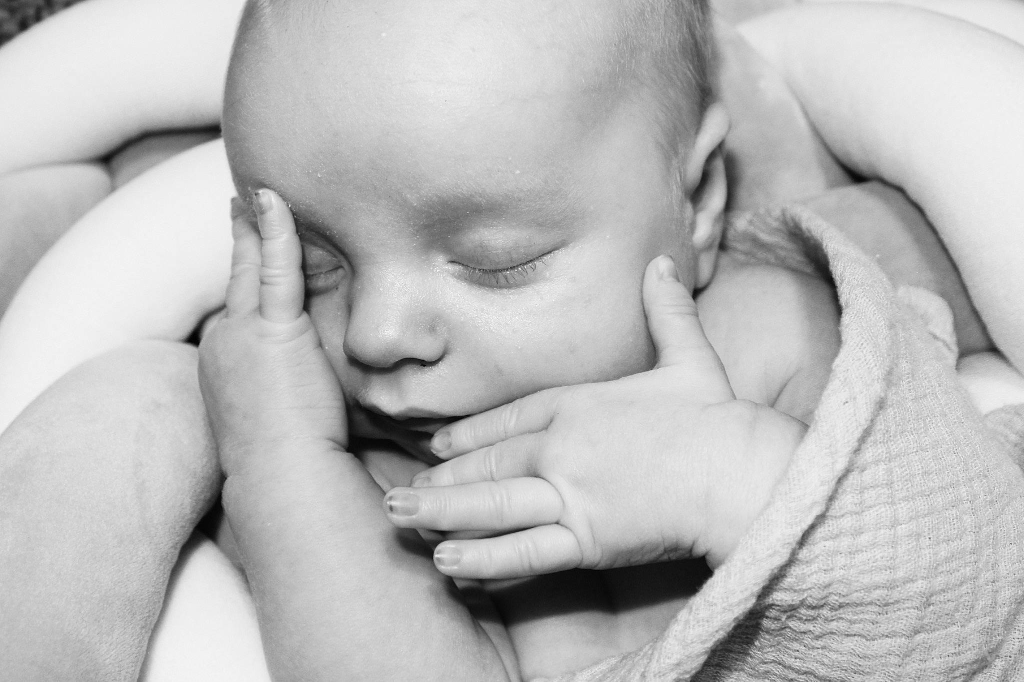 Legend is registered to the contest to win money with this photo: arm, baby, black_and_white, cheek, comfort, ear, eye, eyebrow, eyelash, finger, gesture, hand, happy, human_body, lip, mouth, nail, nose, person, photograph