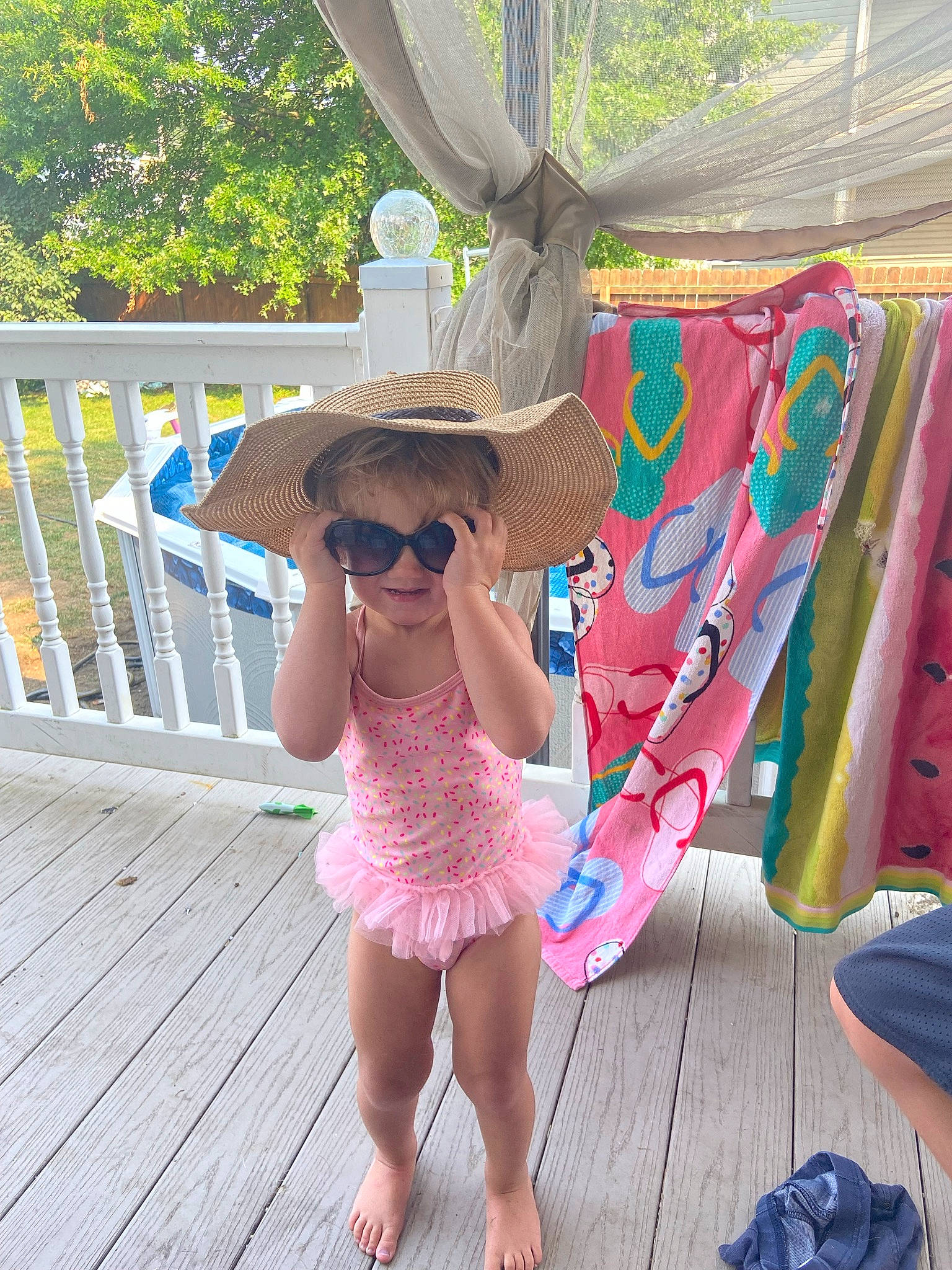 Harper joined the competition — help win amazing prizes! blue, dress, event, eyewear, fedora, fence, fun, glasses, goggles, hat, joy, leisure, magenta, outdoor_furniture, person, pink, plant, recreation, sun_hat, sunglasses