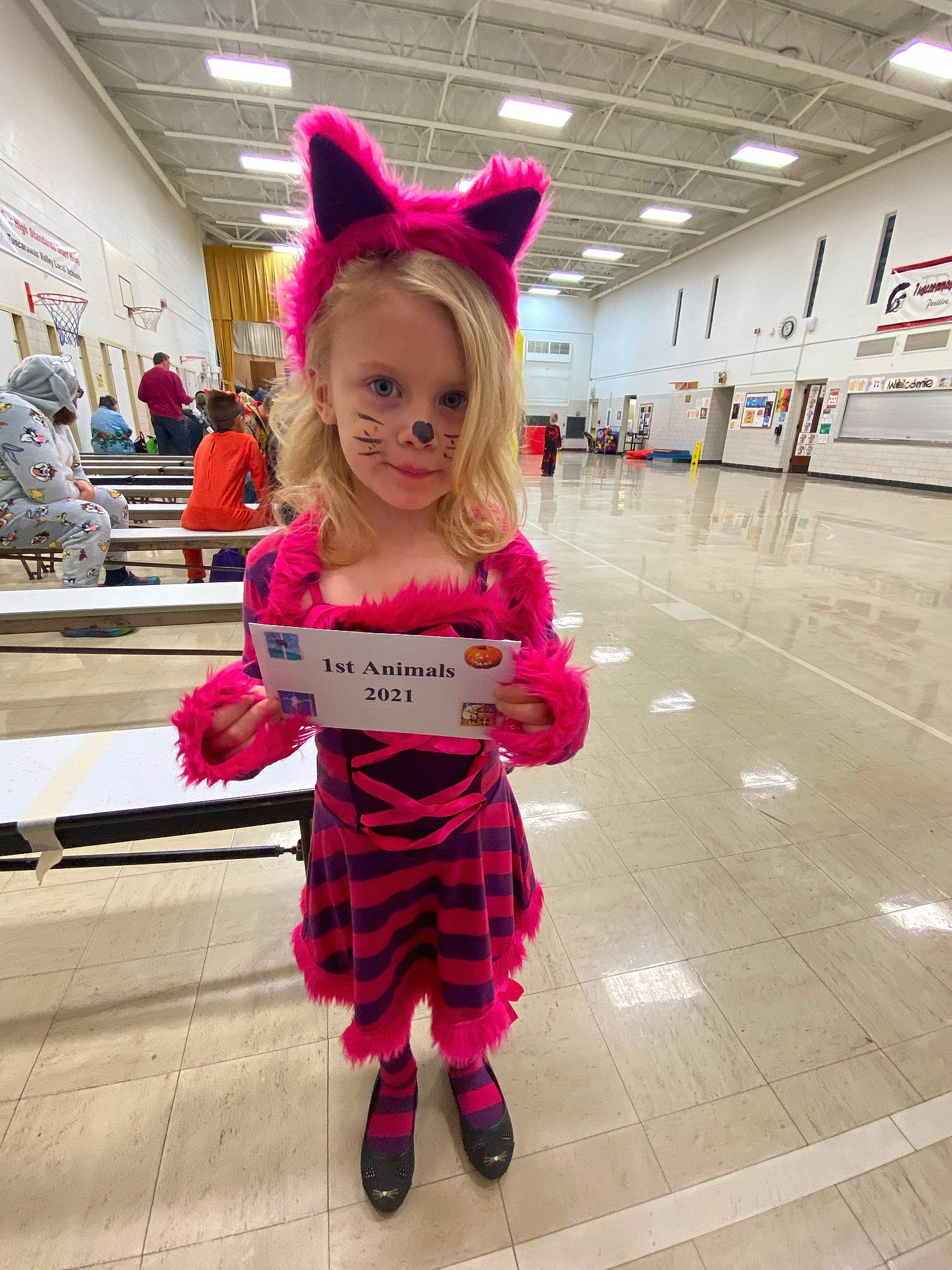 Addilyn is registered to the contest to win money with this photo: boot, child, costume, event, fashion_accessory, fashion_design, fictional_character, flooring, fun, fur, magenta, pattern, person, pink, plaid, red, sock, street_fashion, tartan, textile