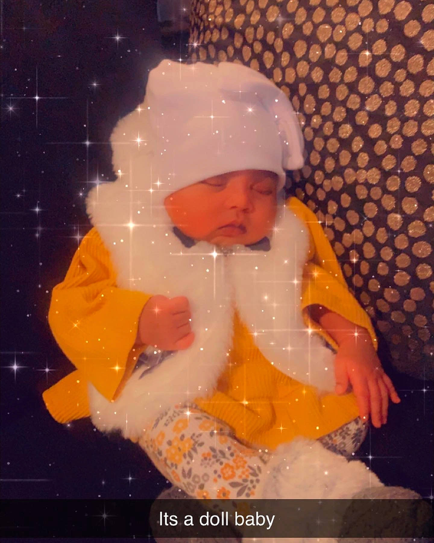 Seyven is registered to the contest to win money with this photo: baby, cheek, child, christmas_eve, event, flesh, freezing, fun, happy, headwear, holiday, lap, person, sitting, snow, space, thumb, toddler, winter