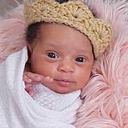 Treyana is registered to the contest to win money with this photo: baby, blanket, closeup, comfort, cozy, crown, cute, expression, eyes, face, fluffy, hands, headwear, infant, knitted, newborn, pink, portrait, soft, wrapped