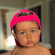 Daniel joined the competition — help win amazing prizes! baby, blue_eyes, casual, child, chubby_cheeks, closeup, curly_hair, cute, drool, expression, face, hat, headwear, indoors, looking_at_camera, person, pink_cap, portrait, skin, young_child