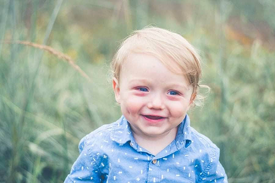 Marvin is registered to the contest to win money with this photo: baby, child, electric_blue, eye, face, flash_photography, fun, grass, happy, iris, joy, meadow, people_in_nature, person, plant, skin, smile, t_shirt, toddler, tree