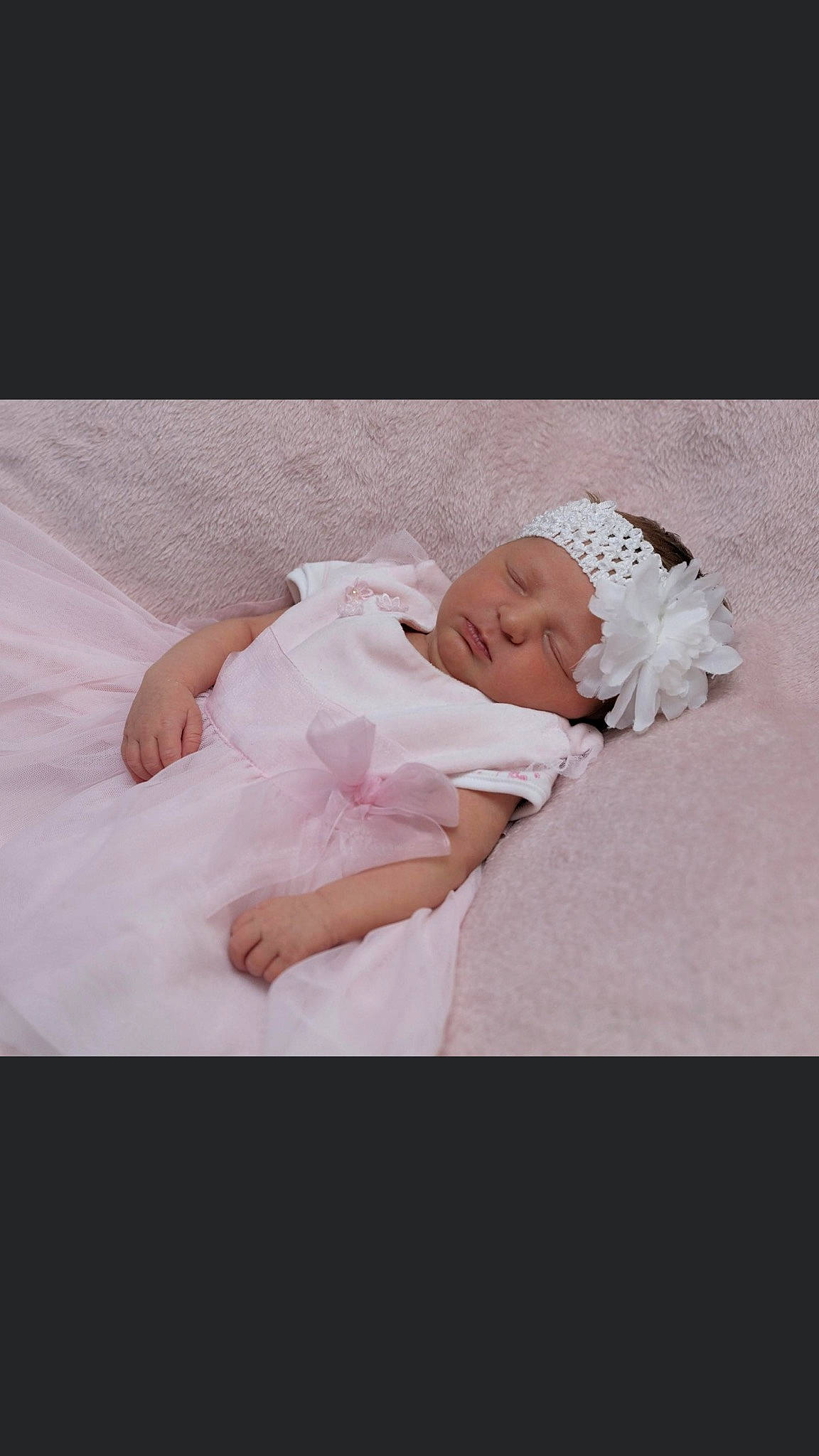 Larissa is registered to the contest to win money with this photo: baby, baby_sleeping, bridal_accessory, bridal_clothing, child, dress, gown, hair_accessory, headgear, headpiece, headwear, person, photograph, photography, pink, product, textile, toddler, wedding_dress, white