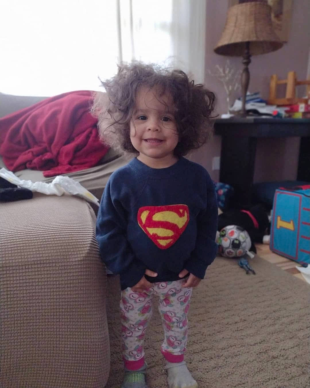 Adayln joined the competition — help win amazing prizes! baby_toddler_clothing, clothing, couch, eye, face, fictional_character, floor, flooring, fun, happy, head, human_body, joy, lamp, living_room, person, sleeve, smile, t_shirt, toddler