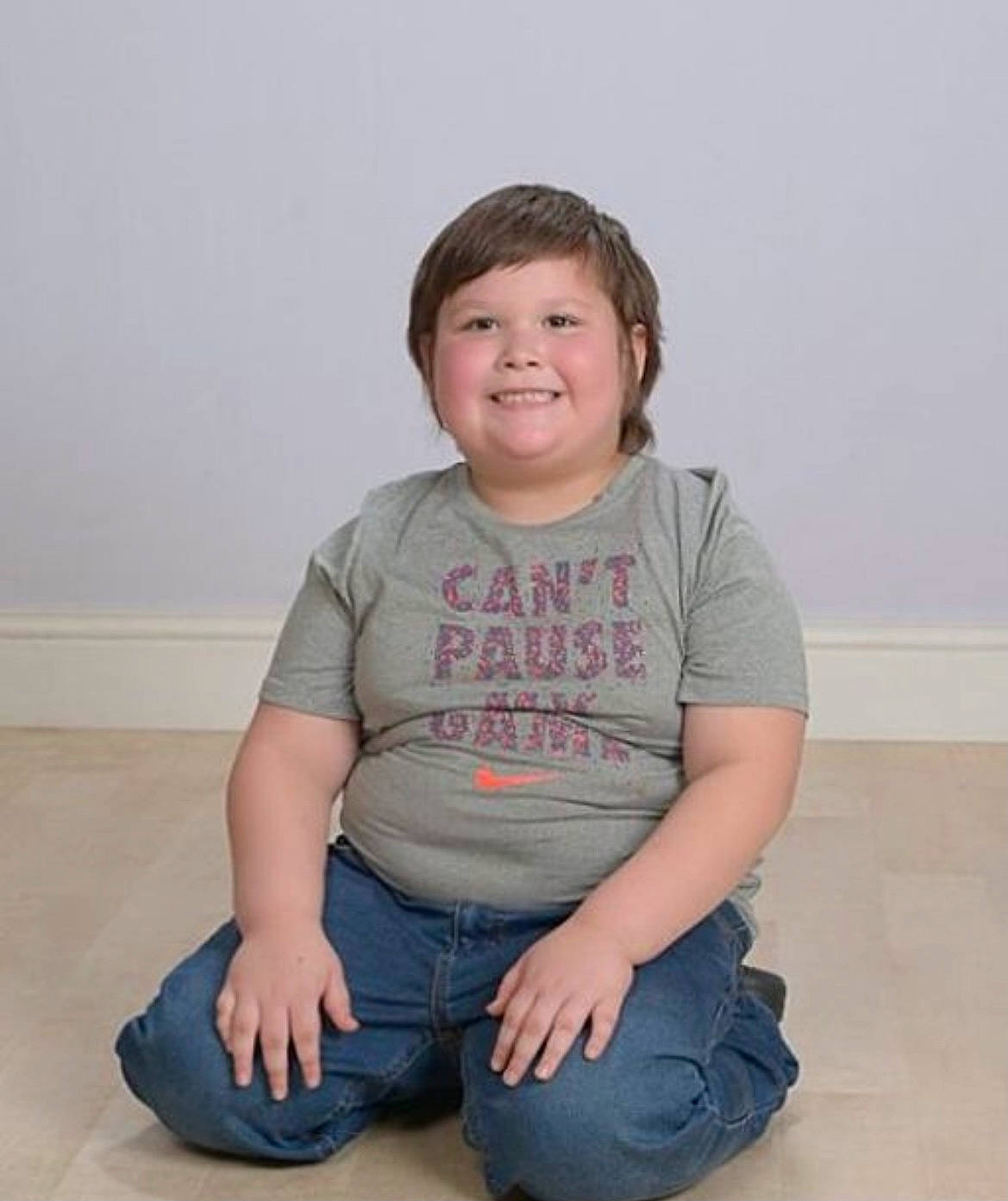 Kolton is registered to the contest to win money with this photo: arm, baby_toddler_clothing, cheek, chin, elbow, forehead, happy, jeans, joint, joy, knee, neck, nose, person, skin, sleeve, smile, standing, t_shirt, thigh