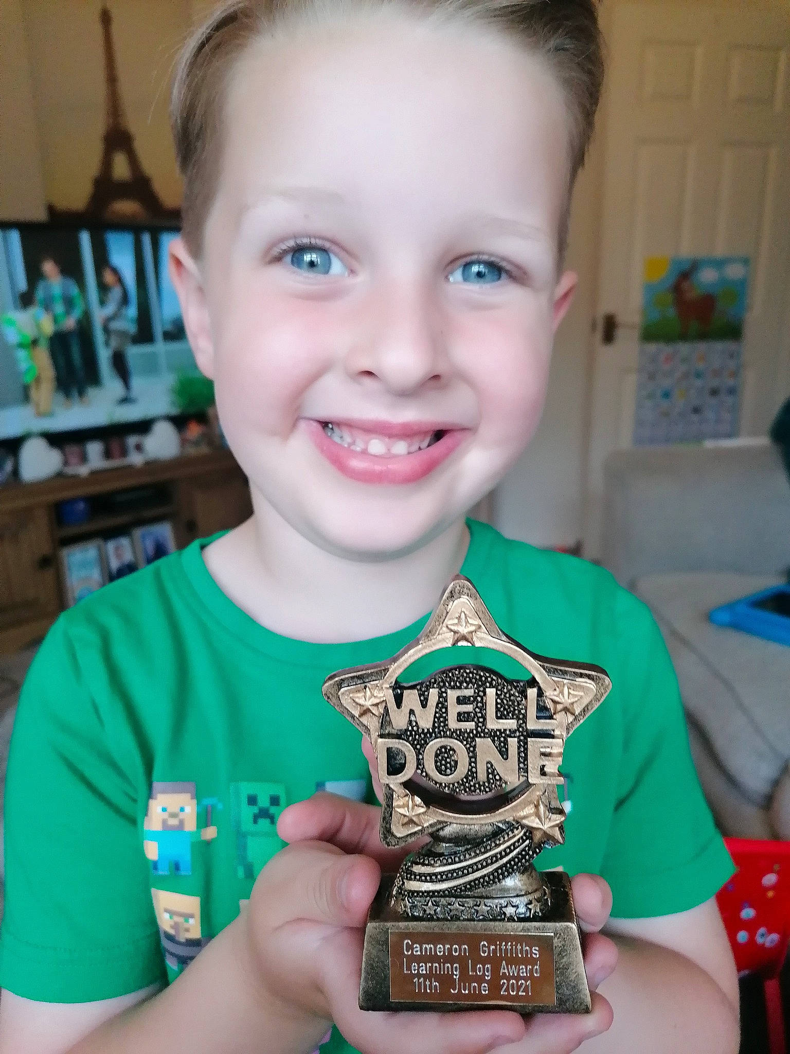 Cameron is registered to the contest to win money with this photo: chair, cheek, child, electric_blue, event, eye, face, fun, happy, head, iris, joy, laugh, logo, person, play, recreation, room, smile, t_shirt