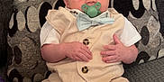 Gunter joined the competition — help win amazing prizes! baby, beige_clothing, blue_shoes, bow_tie, child, couch, curious_expression, cushion, cute, face, head, indoor, infant, pacifier, patterned, shorts, sitting, small_hands, socks, vest