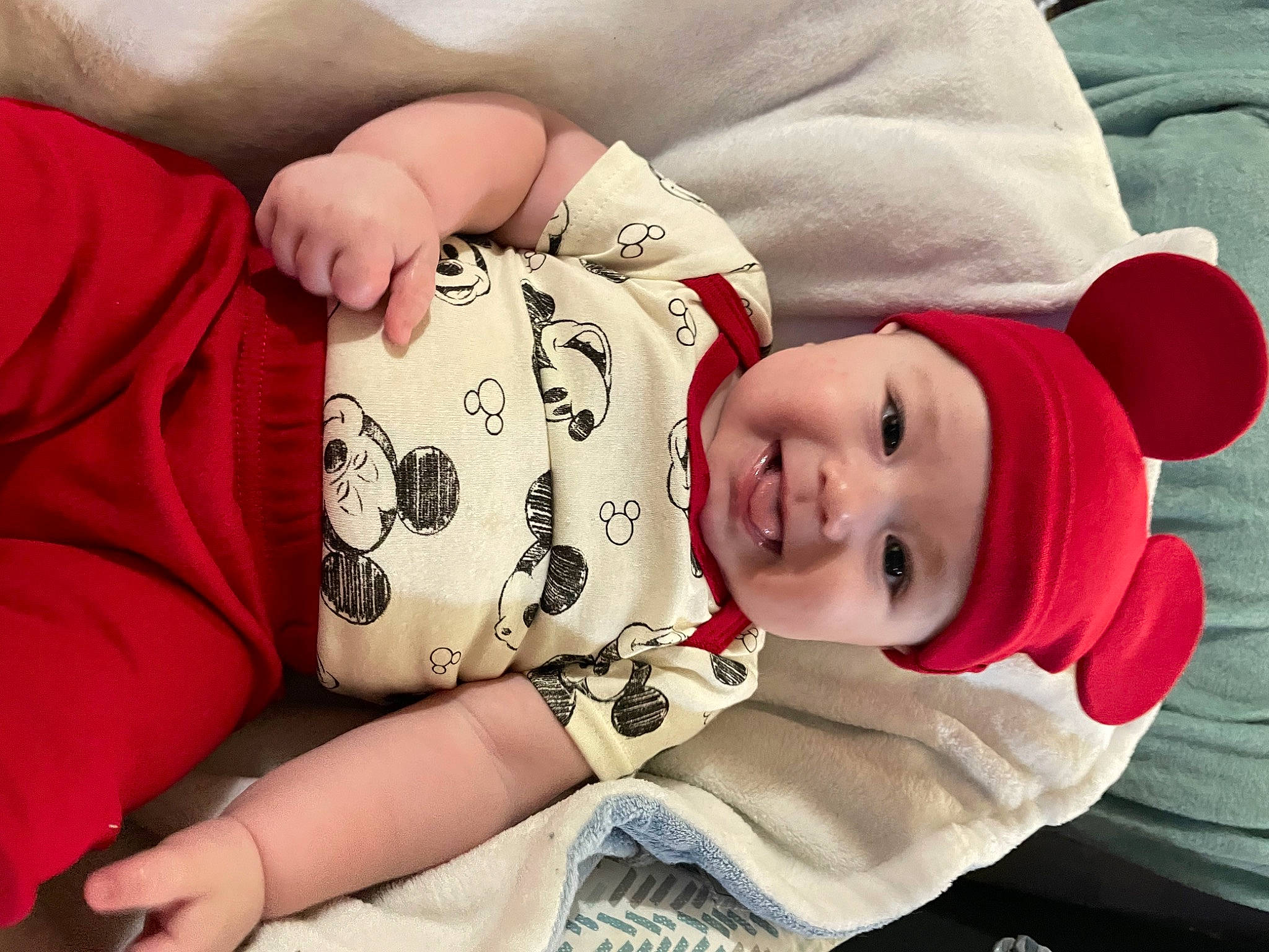 Korbin is registered to the contest to win money with this photo: baby, baby_toddler_clothing, carmine, cheek, child, comfort, elbow, eyelash, fur, happy, hat, headwear, human_leg, joy, pattern, person, portrait_photography, sitting, skin, sleeve