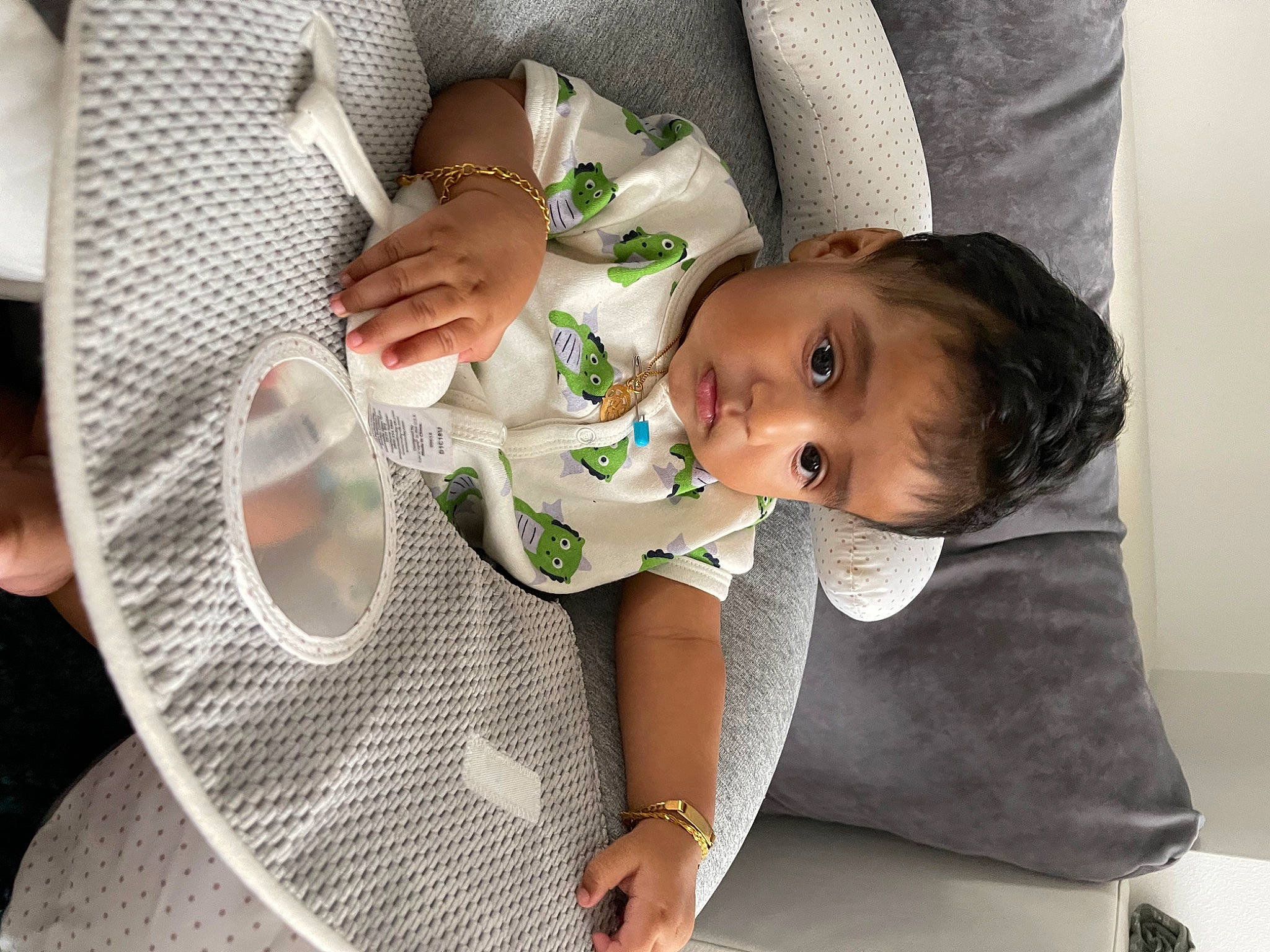 Varun joined the competition — help win amazing prizes! baby, baby_products, baby_toddler_clothing, child, circle, coffee_cup, comfort, cup, dishware, drinkware, finger, hand, happy, nail, pattern, person, serveware, sitting, sleeve, tableware