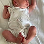 órla Rowan Fay is registered to the contest to win money with this photo: baby, newborn, infant, sleeping, onesie, floral, white_blanket, soft, peaceful, cute, hands, feet, lying_down, child, skin, portrait, resting, indoors, newborn_baby, sleep