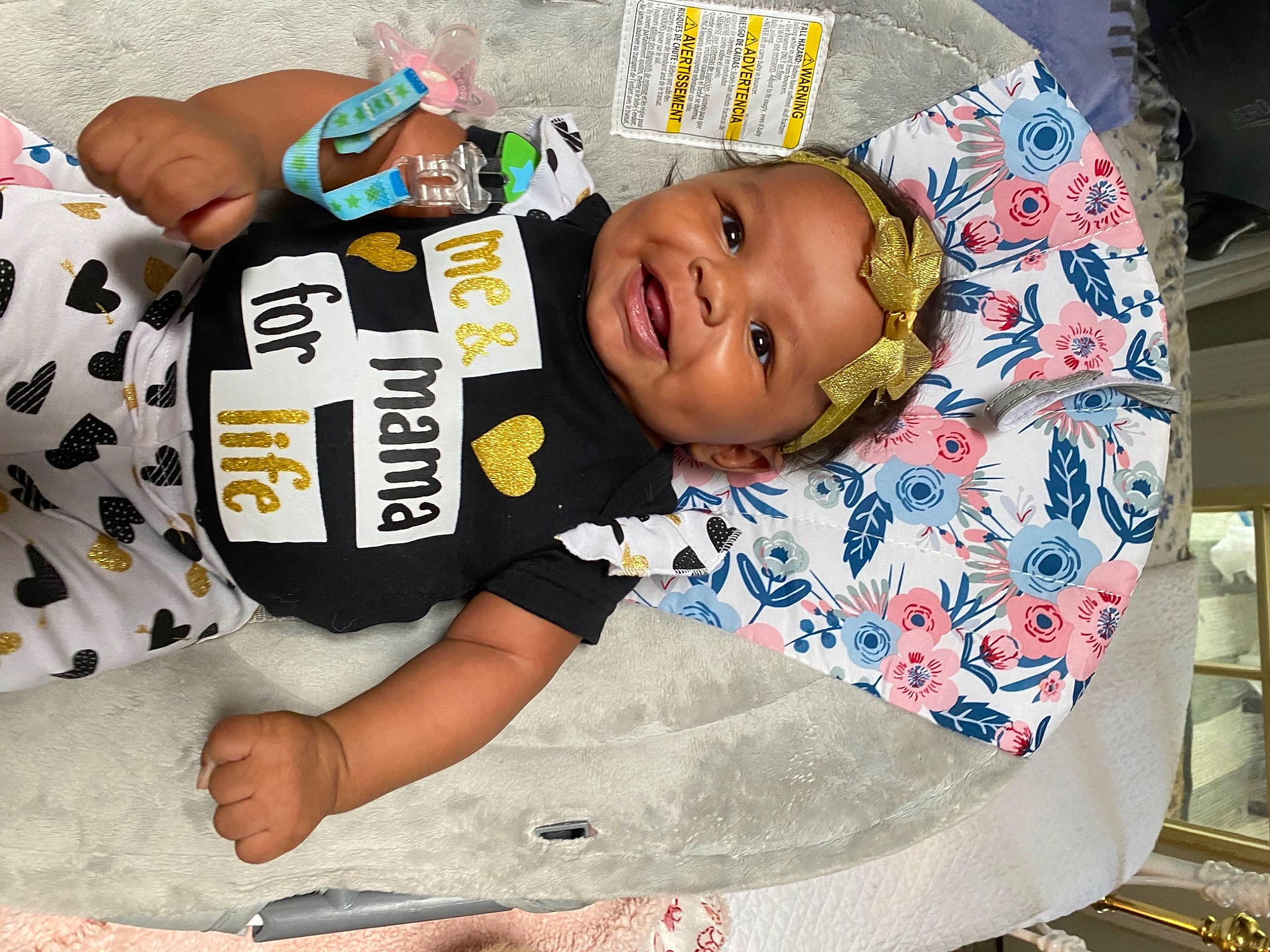 Ja'Laiyah is registered to the contest to win money with this photo: arm, baby, baby_products, baby_safety, baby_toddler_clothing, cheek, child, comfort, happy, head, linens, pattern, person, room, sitting, sleeve, smile, t_shirt, textile, thigh