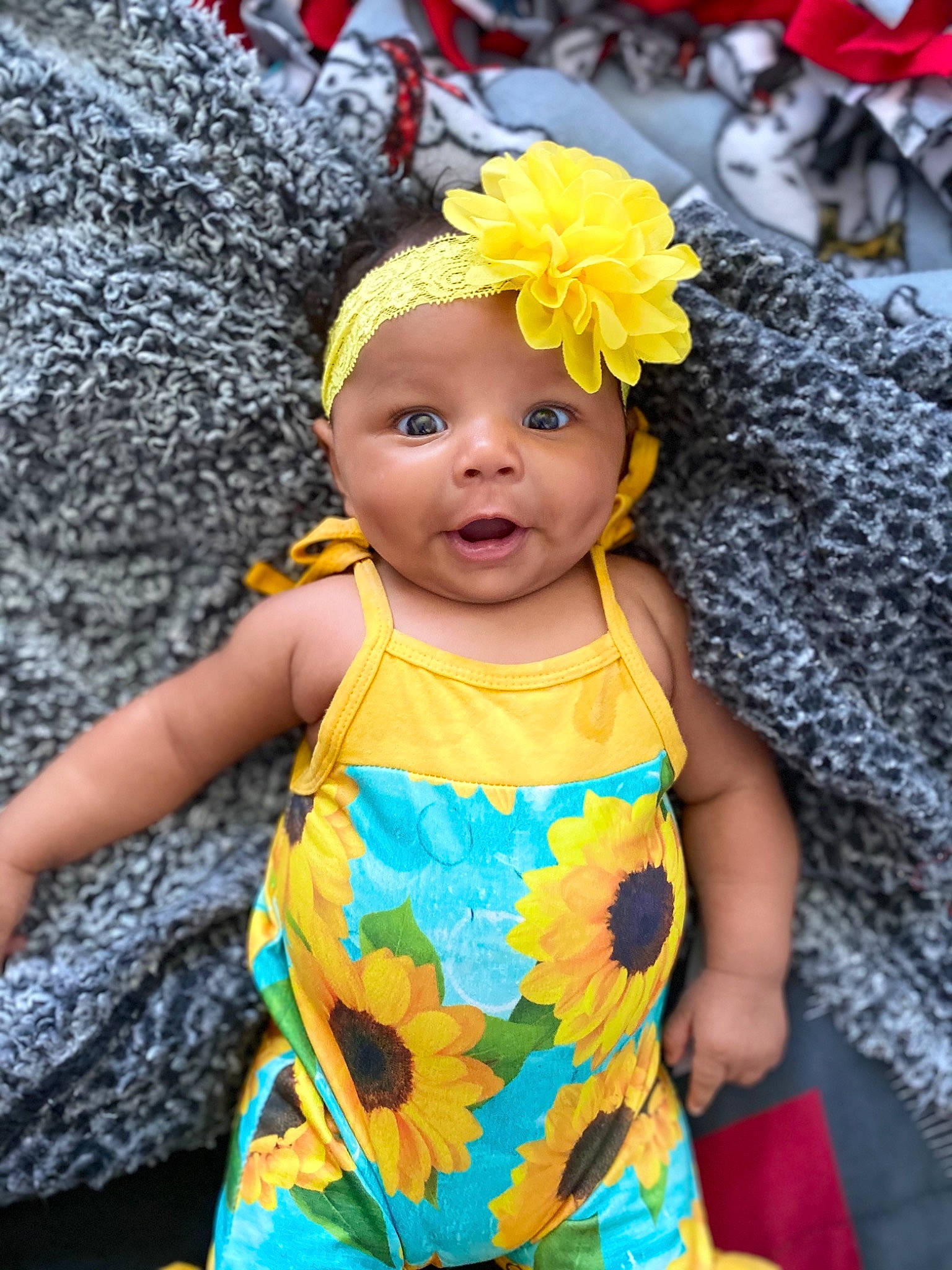 Ja'Laiyah is registered to the contest to win money with this photo: baby, baby_toddler_clothing, cap, child, dress, event, eye, fun, happy, hat, headband, headpiece, headwear, jewellery, pattern, person, plant, sleeve, sun_hat, textile
