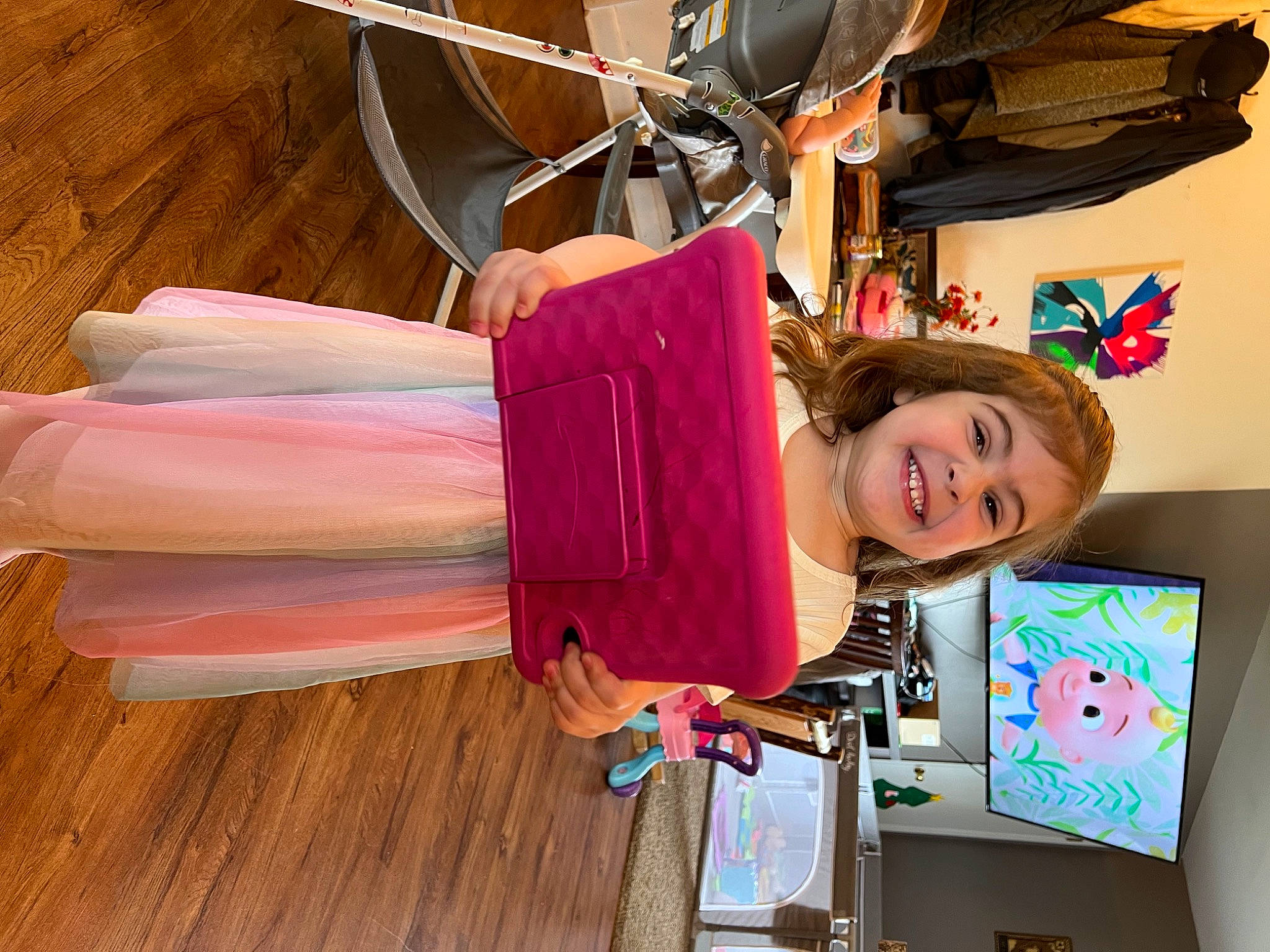 Addison joined the competition — help win amazing prizes! bicycle_wheel, child, flag, fun, happy, hardwood, joy, magenta, person, room, smile, textile, tire, toddler, wheel, wood