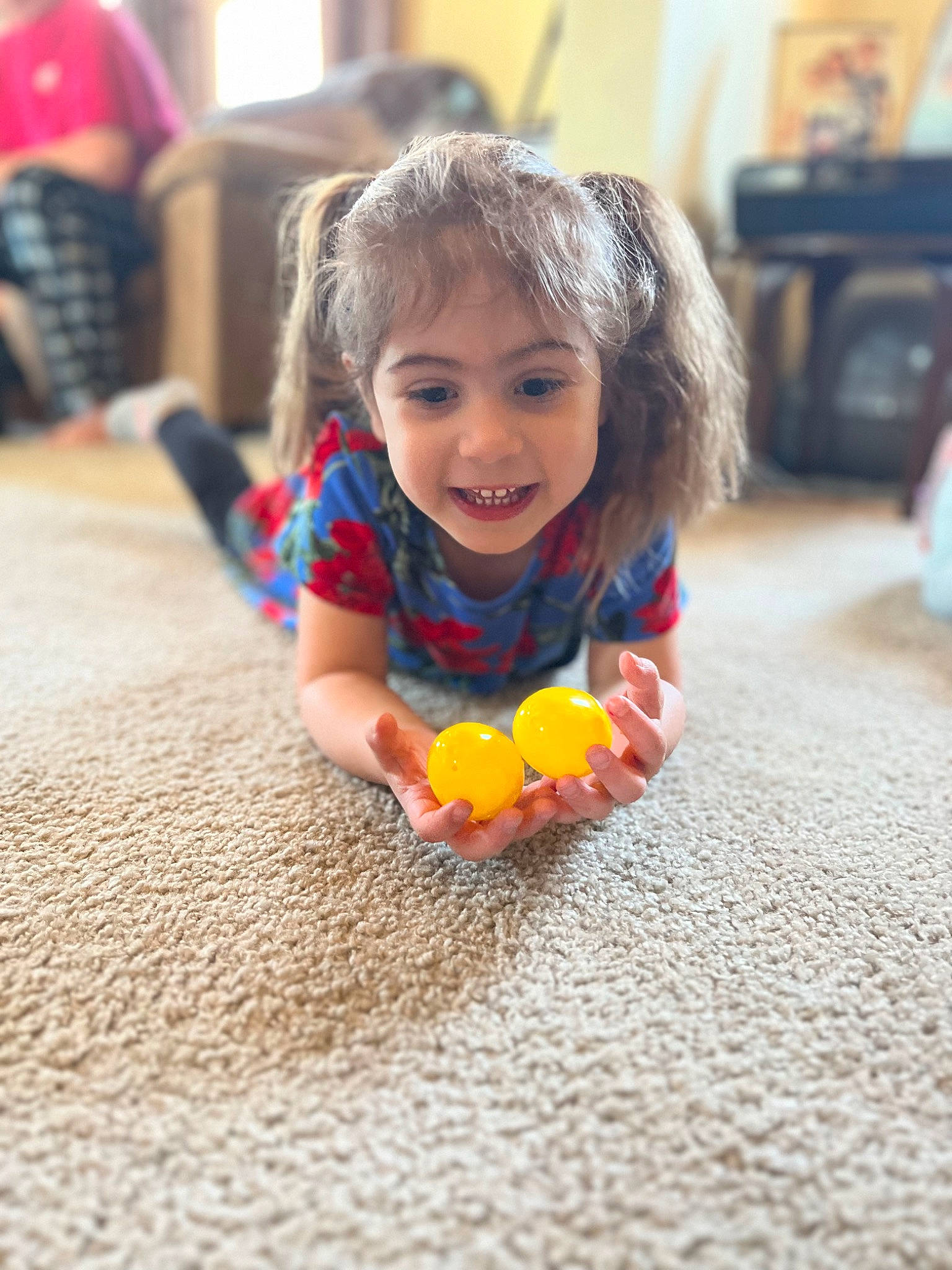 Addison joined the competition — help win amazing prizes! asphalt, baby, cheek, child, eye, floor, flooring, fun, happy, hardwood, head, human_leg, joy, person, petal, play, road_surface, room, sitting, smile