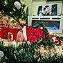 Dariel is registered to the contest to win money with this photo: baby, sleeping, christmas_tree, christmas_lights, red_clothing, reindeer_hat, garland, holiday, fireplace, decorations, indoors, festive, cozy, blanket, candlelight, cute, holiday_season, festive_hat, christmas_decor, infant