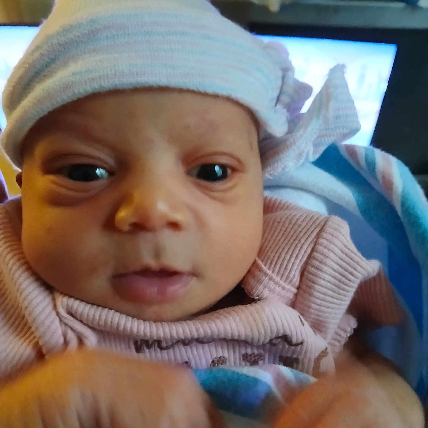 Zamiyah joined the competition — help win amazing prizes! baby, beanie, bodypart, bonnet, cap, clothing, computerhardware, electronics, face, finger, hand, hardware, hat, head, monitor, newborn, person, photography, portrait, screen