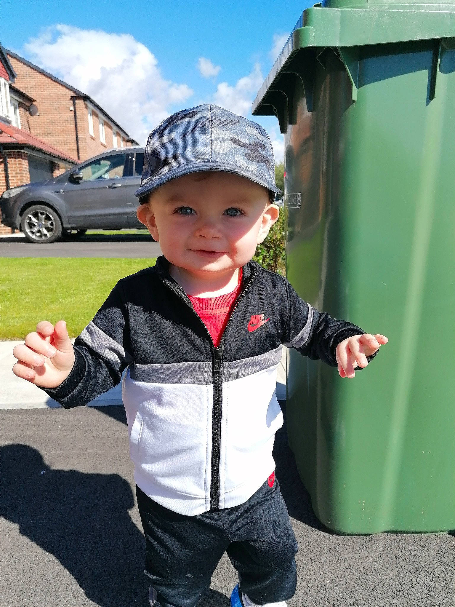 Markus joined the competition — help win amazing prizes! baby, baseball_cap, car, child, cloud, electric_blue, fun, gesture, grass, hat, headwear, leisure, person, recreation, sky, sleeve, street_fashion, sun_hat, tire, toddler