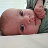 Telio participe au concours pour gagner de l'argent avec cette photo : baby, infant, face, hand, eyes, skin, expression, closeup, portrait, laying_down, soft_surface, cozy, cute, child, newborn, clothing, indoors, person, peaceful, resting