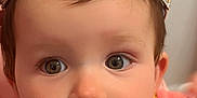 Angelina is registered to the contest to win money with this photo: baby, child, crown, jewelry, face, portrait, cute, pink_clothing, expression, eyes, infant, adorable, headwear, closeup, childhood, fashion, person, young, innocent, indoor