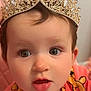 baby, child, crown, jewelry, face, portrait, cute, pink_clothing, expression, eyes, infant, adorable, headwear, closeup, childhood, fashion, person, young, innocent, indoor