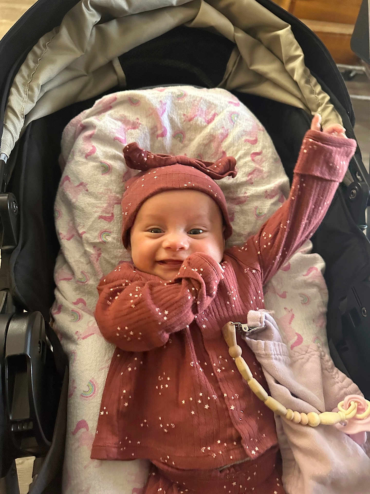 Freya joined the competition — help win amazing prizes! baby, infant, smile, stroller, blanket, hat, clothing, cute, happy, child, portrait, indoors, fabric, toy, pacifier, accessory, pink, maroon, pattern, cozy