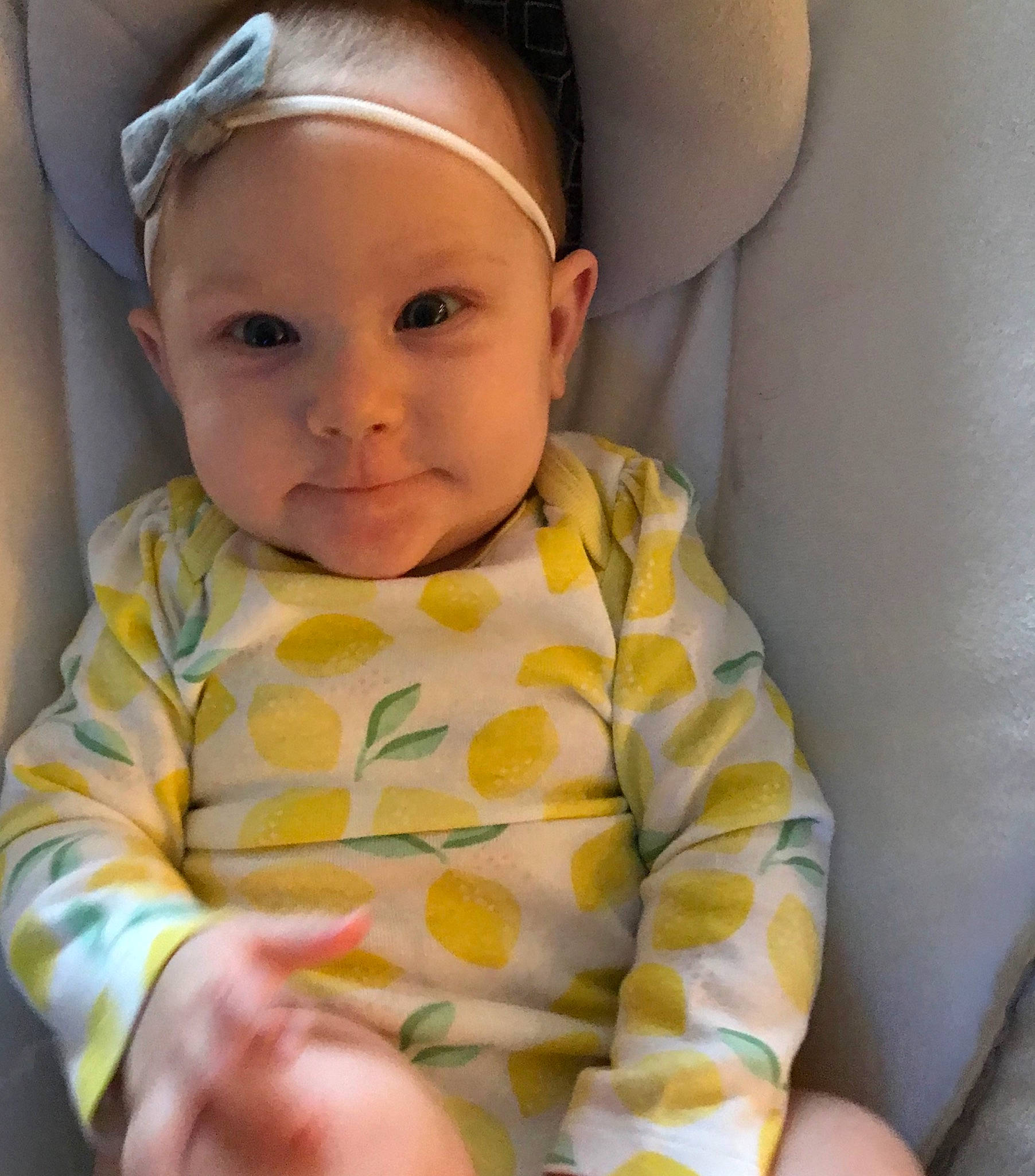 Callahan is registered to the contest to win money with this photo: baby, baby_toddler_clothing, cheek, child, ear, eye, face, hair_accessory, head, lip, person, skin, sleeve, smile, toddler, yellow