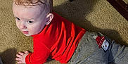 Cato joined the competition — help win amazing prizes! baby, child, crawling, red_sweater, gray_pants, penguin_patch, carpet, wooden_crib, indoor, floor, infant, cute, young_child, clothing, person, carpeted_floor, home, furniture, curious, expression