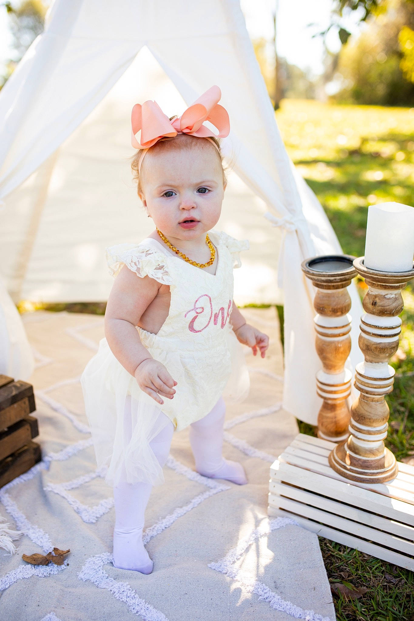Emerson is registered to the contest to win money with this photo: baby, baby_toddler_clothing, bridal_accessory, bridal_clothing, child, dress, event, fashion_accessory, fun, grass, happy, headpiece, orange, party_supply, peach, person, product, summer, toddler, wedding_ceremony_supply