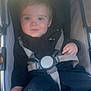 Theo is registered to the contest to win money with this photo: toddler, child, stroller, seatbelt, black_clothing, face, baby, infant, outdoor, person, young_child, hoodie, straps, sitting, cute, smile, portrait, baby_stroller, casual, daylight