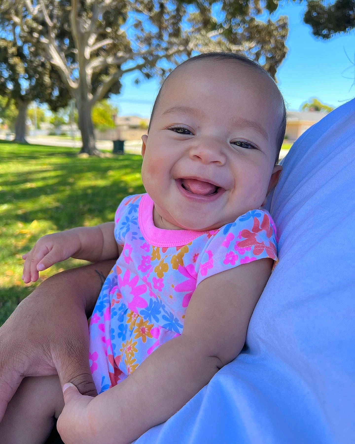 Aliyah joined the competition — help win amazing prizes! arm, azure, baby, baby_toddler_clothing, blue, facial_expression, gesture, grass, hand, happy, iris, joy, leaf, people_in_nature, person, plant, shoulder, skin, smile, standing