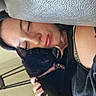 Faith is registered to the contest to win money with this photo: person, cat, black_cat, sleeping, couch, leather, hand, collar, indoor, resting, closeup, nap, feline, pet, affection, relaxation, human, snuggle, comfort, quiet