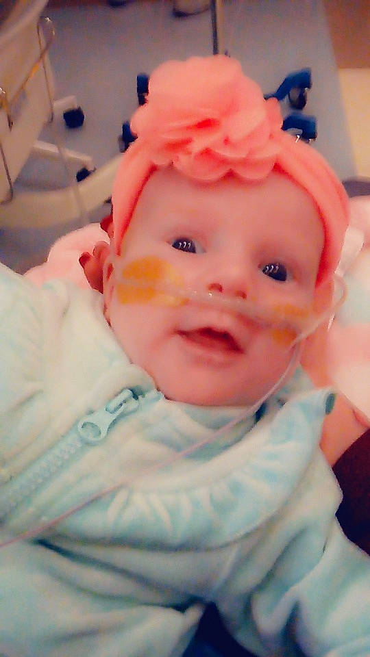 Adalena is registered to the contest to win money with this photo: baby, cheek, child, eye, face, head, headgear, iris, lip, mouth, nose, person, pink, skin, smile, toddler