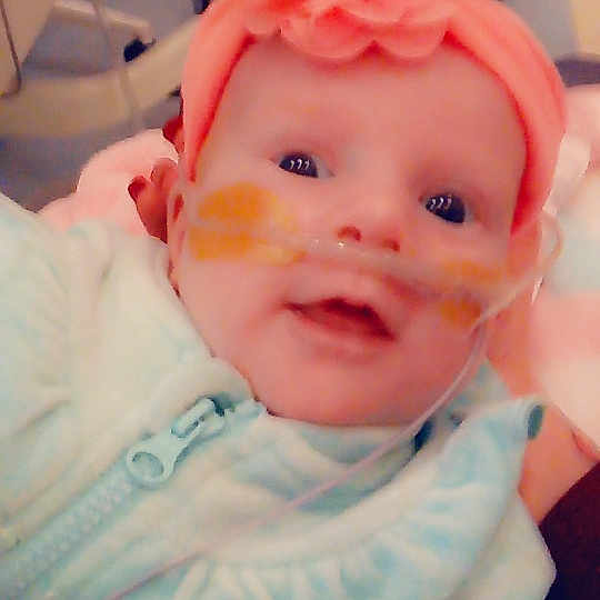 Adalena is registered to the contest to win money with this photo: baby, cheek, child, eye, face, head, headgear, iris, lip, mouth, nose, person, pink, skin, smile, toddler