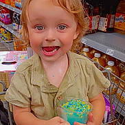 Huxon joined the competition — help win amazing prizes! child, toddler, smiling, shopping_cart, grocery_store, supermarket_shelves, blue_dessert, sprinkles, spoon, messy_face, blond_hair, short_sleeves, candid, portrait, happy, holding, sitting, juice_bottles, product_shelves, cart_seat
